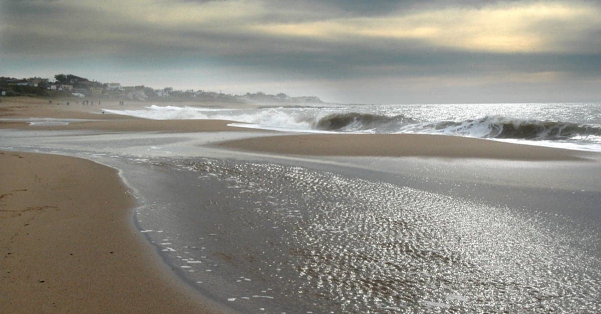 Waves rolling onto a wide Atlantic beach on the Uruguay coast