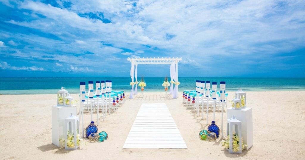 A romantic beachfront wedding ceremony in Jamaica with golden sand and turquoise water
