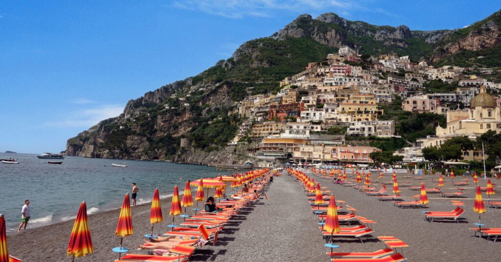 The colorful cliffside village of Positano cascading down to the beach on the Amalfi Coast
