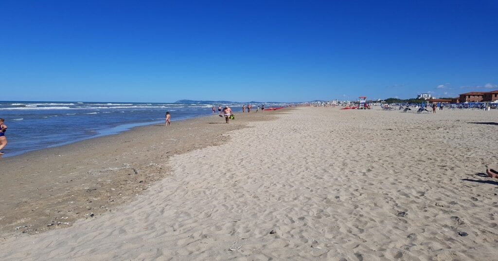 The long sandy beach and lively waterfront of Rimini on Italy's Adriatic coast
