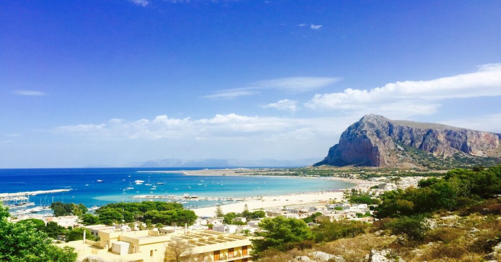 The white sand and crystal-clear turquoise waters of San Vito Lo Capo beach in Sicily