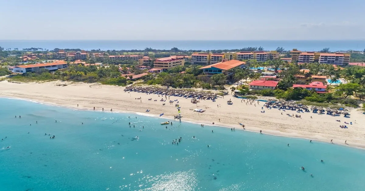 Varadero Beach in Cuba with white sand extending along the narrow peninsula and calm blue water