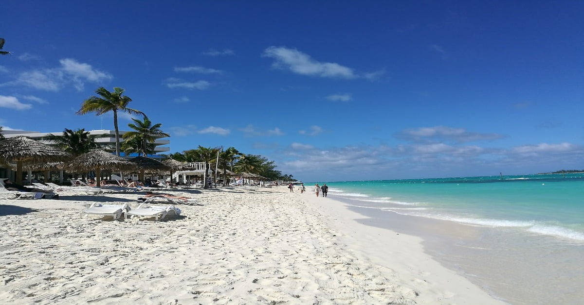 Cable Beach in Nassau, Bahamas, lined with luxury resorts and sparkling turquoise waters
