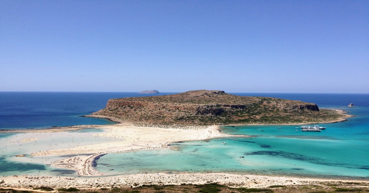 Balos Lagoon in Crete, Greece, with striking turquoise and teal waters meeting white sandy shores
