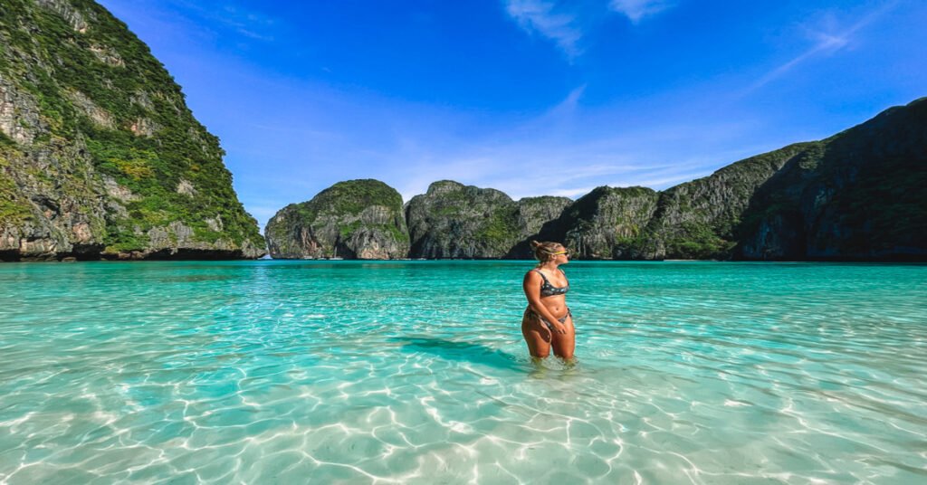 Maya Bay in Thailand surrounded by dramatic limestone cliffs
