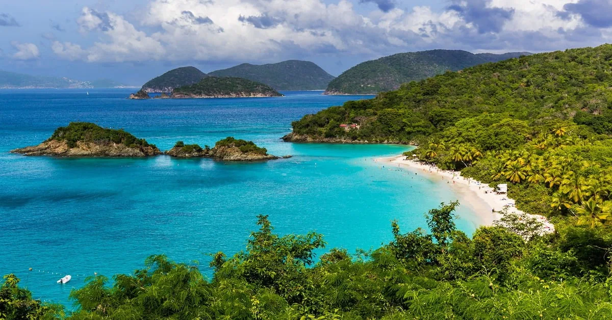 Trunk Bay in St. John with clear water and green hillsides