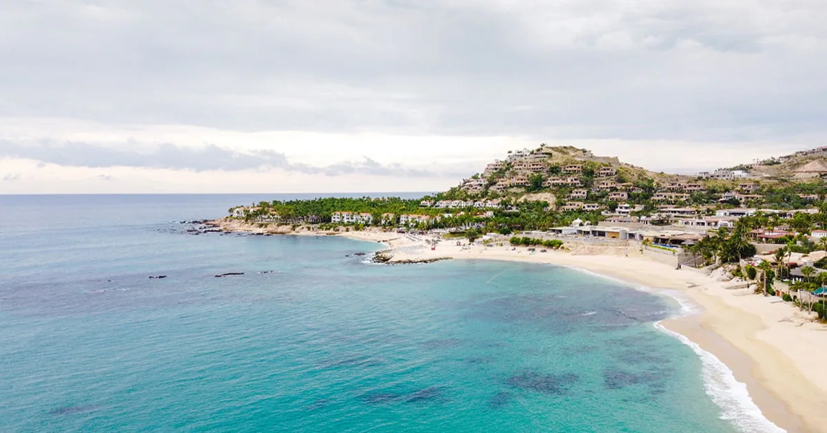 Palmilla Beach in Los Cabos, Mexico with desert landscape meeting the sea