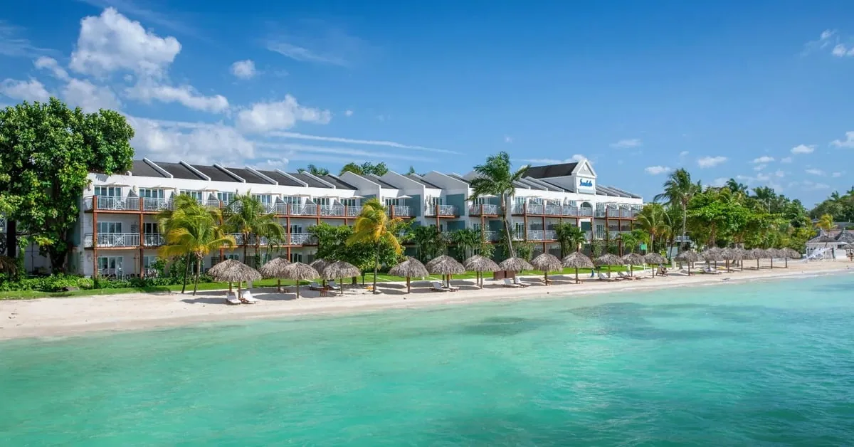 Sandals South Coast resort in Jamaica with over-the-water bungalows extending into the turquoise Caribbean Sea