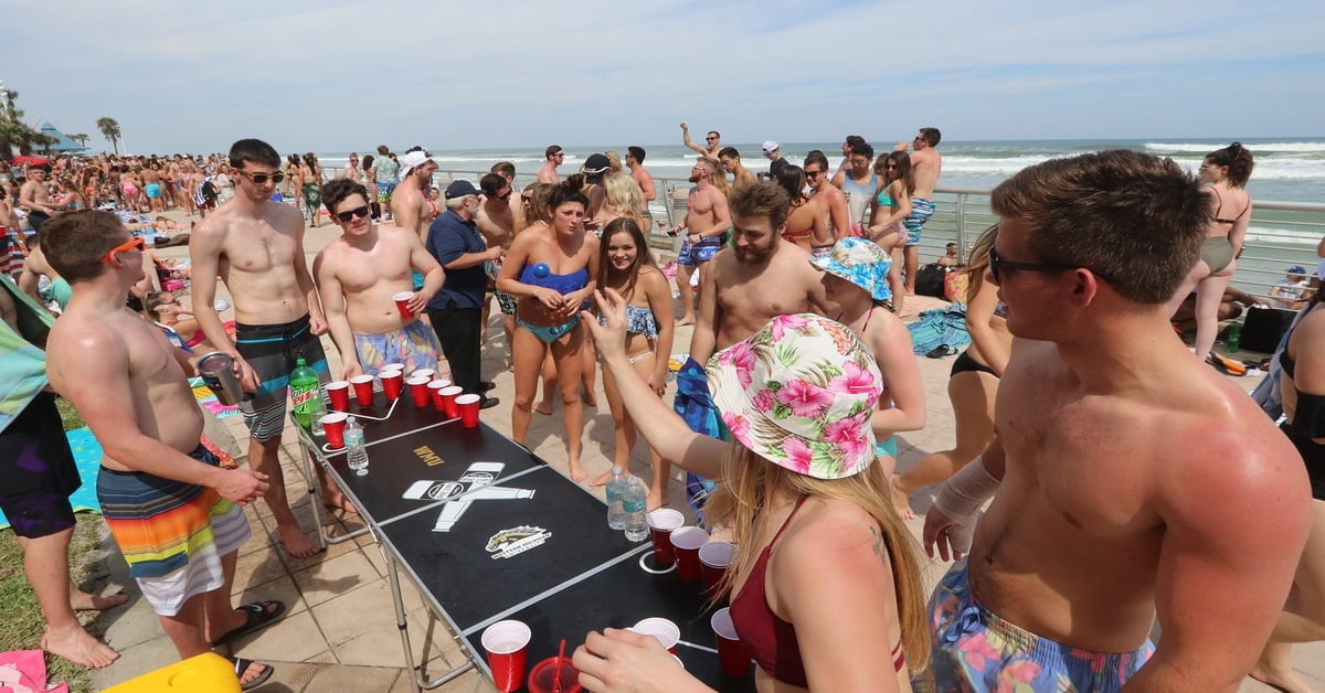 Wide sandy expanse of Daytona Beach, Florida with waves rolling in