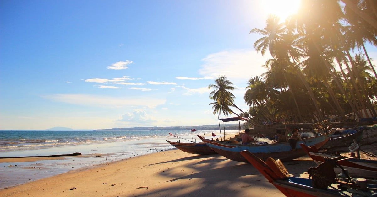 Colorful fishing boats on the shore of Mui Ne Beach in Vietnam