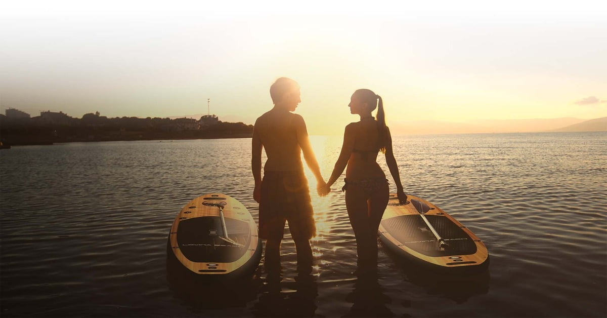 Black sand shore of Lovina Beach in northern Bali at sunrise