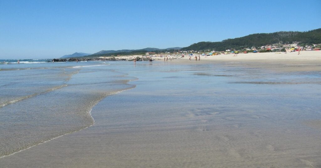 Scenic Praia de Afife beach in northern Portugal surrounded by green hillsides