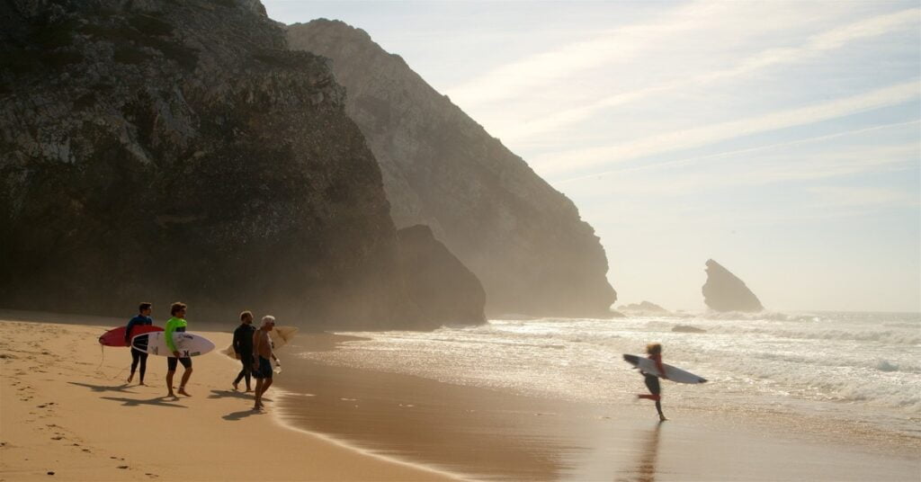 Dramatic cliffs and golden sand at Praia da Adraga near Sintra, Portugal