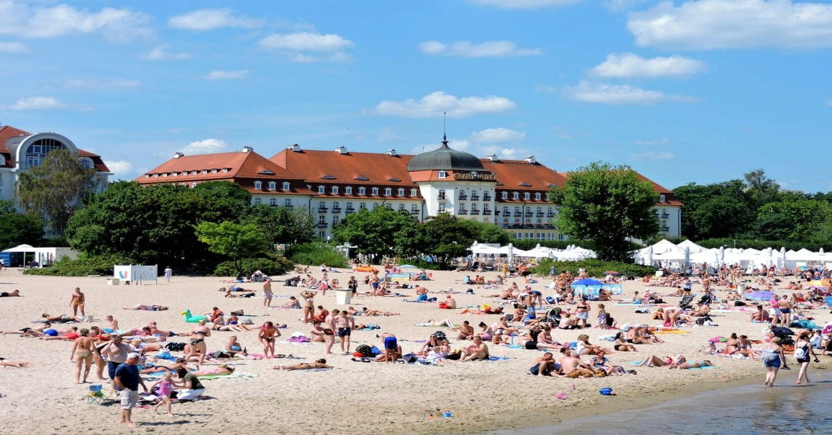 Wide sandy Sopot Beach on the Baltic Sea in Poland with the famous wooden pier
