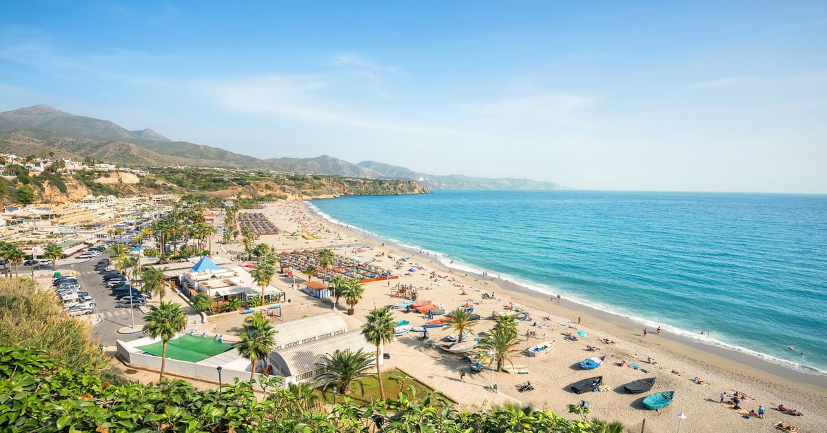 Sun-drenched Costa del Sol coastline in southern Spain with resort buildings