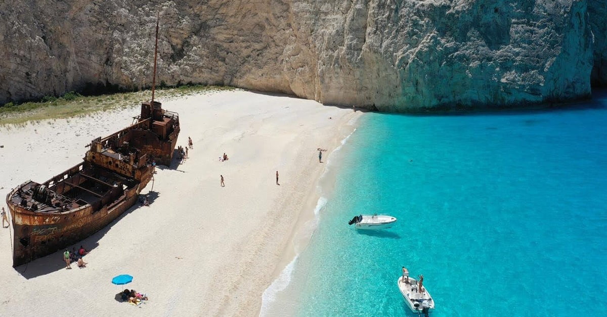 Famous Navagio Shipwreck Beach in Zakynthos, Greece surrounded by towering white cliffs