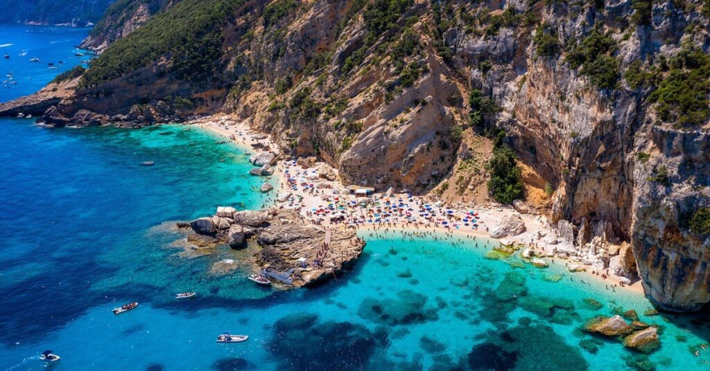 Stunning turquoise water and white cliffs at Cala Mariolu beach in Sardinia, Italy