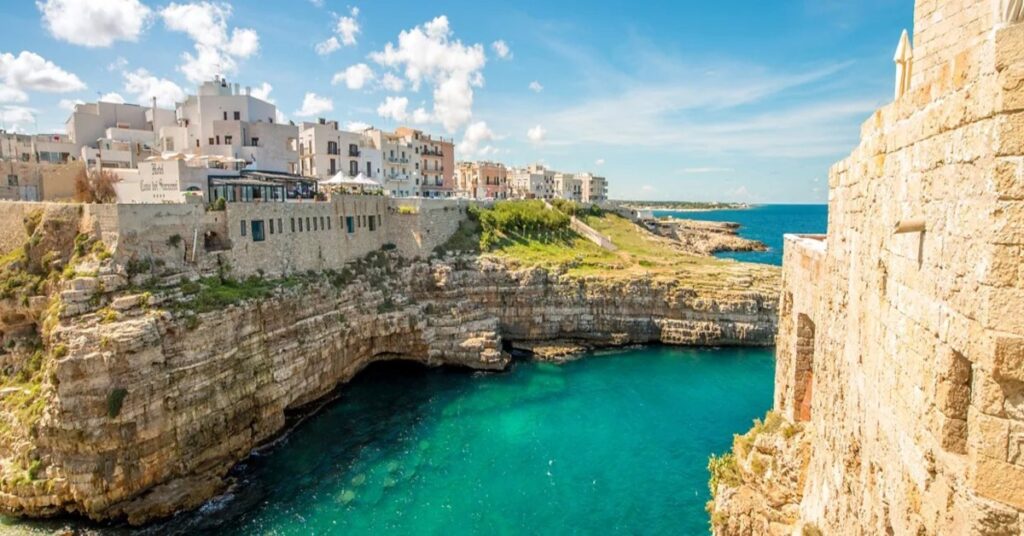 Dramatic cliff-framed beach at Polignano a Mare in Puglia, Italy