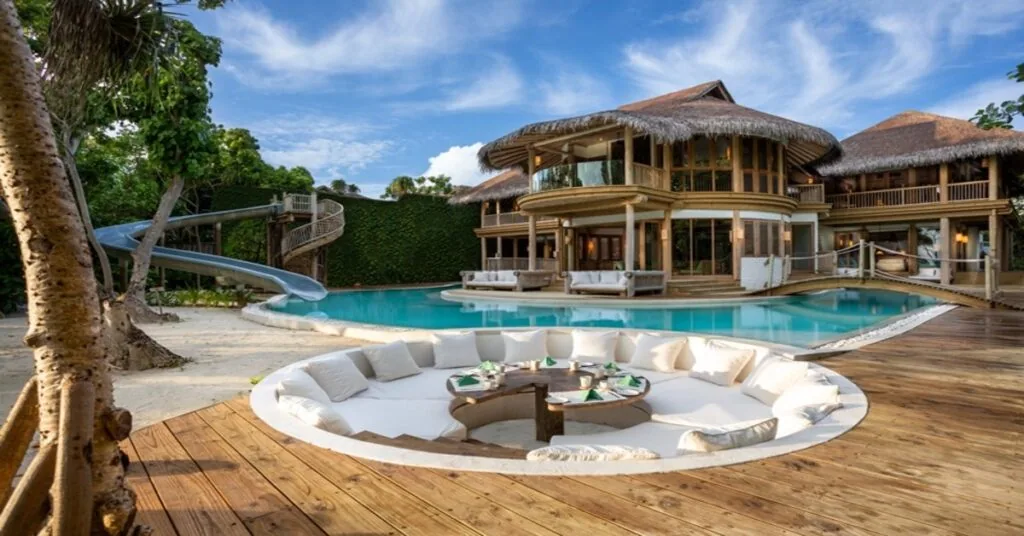 Luxurious beachfront villa surrounded by lush tropical vegetation at Soneva Fushi