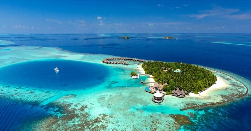 Intimate overwater bungalows at Baros Maldives resort with turquoise lagoon