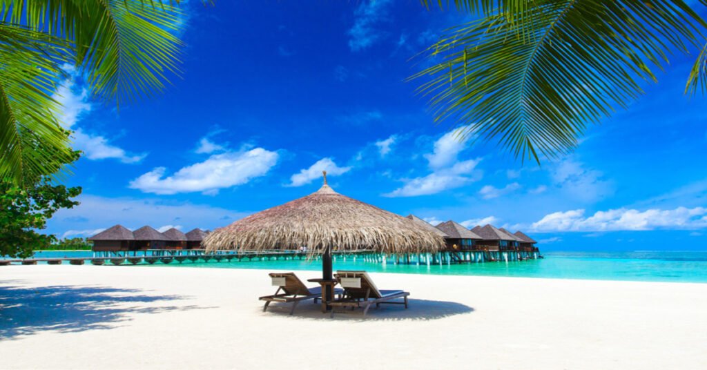 Pristine white sand beach and crystal clear lagoon in the Maldives