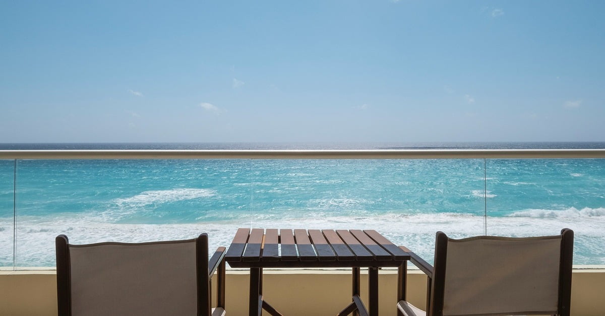 Hotel NYX Cancun beachfront property with white sand and blue waters