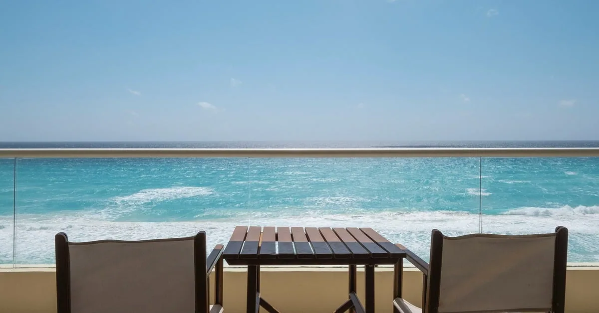 Hotel NYX Cancun beachfront property with white sand and blue waters