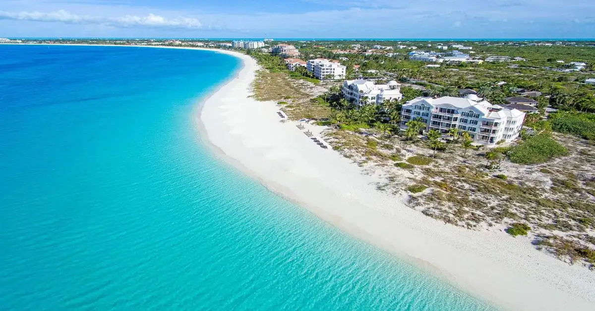 Aerial view of pristine beach resorts along the turquoise coastline of Turks and Caicos