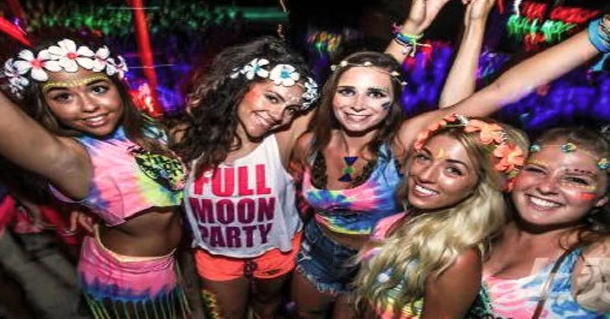 Full moon party celebration on a Thai beach at night